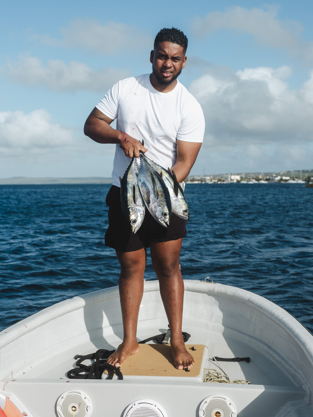 Captain Carlos aboard the Gray Sniper with the day's catch